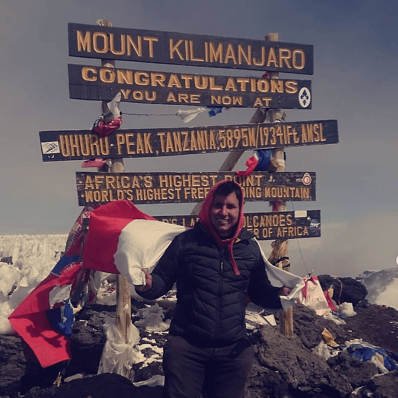 Jy at the top of Mount Kilimanjaro